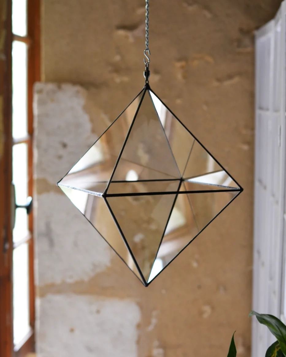 Octahedron hanging in front of the old wall