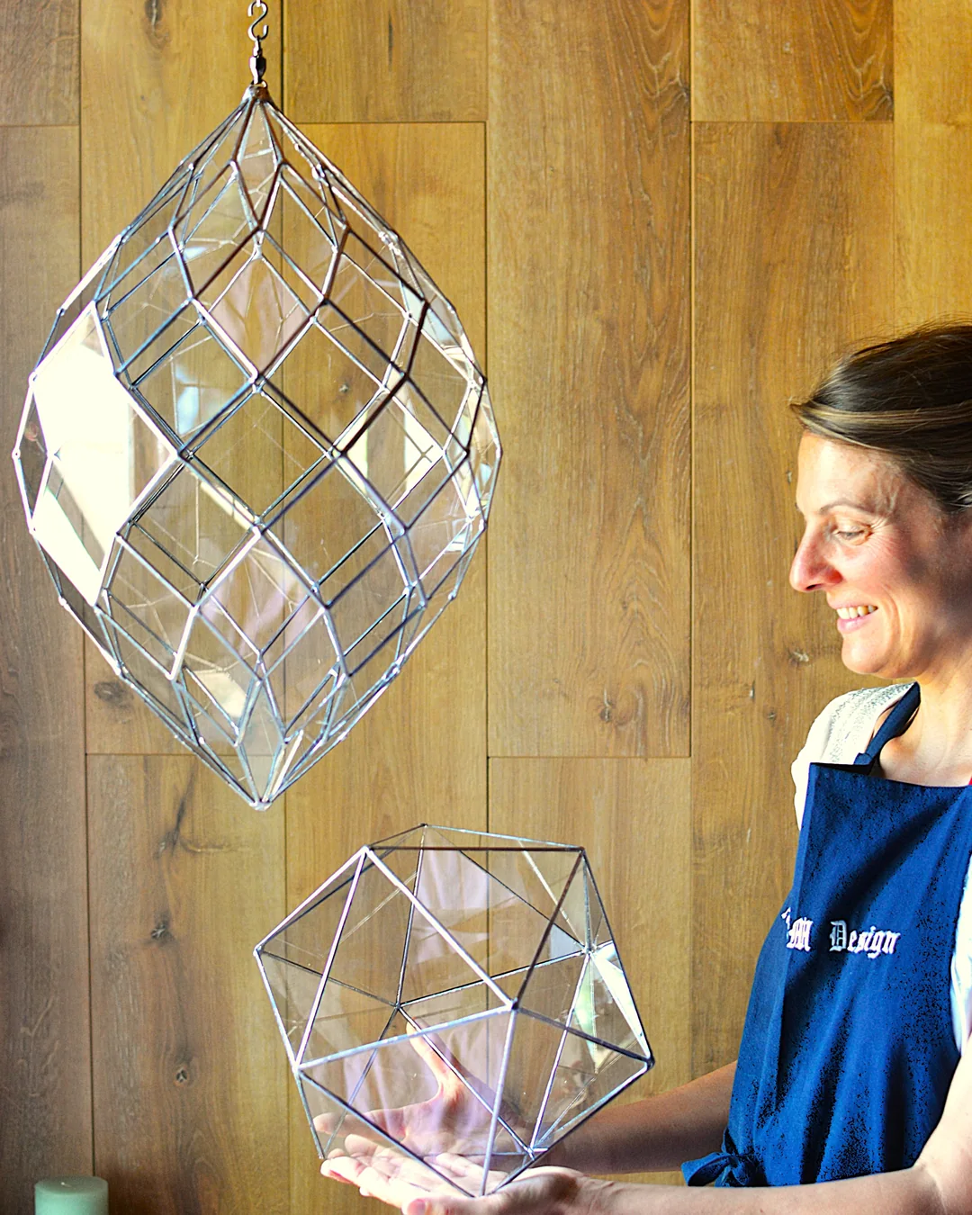 Trainee with her geometries: hanging Yoni 10, icosahedron in hand