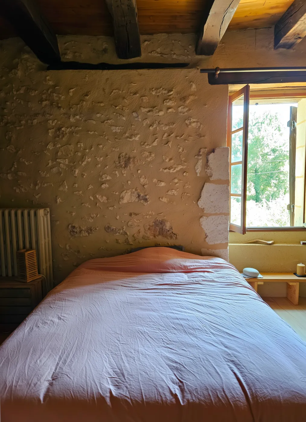 Stone headboard and morning light, the participants' room